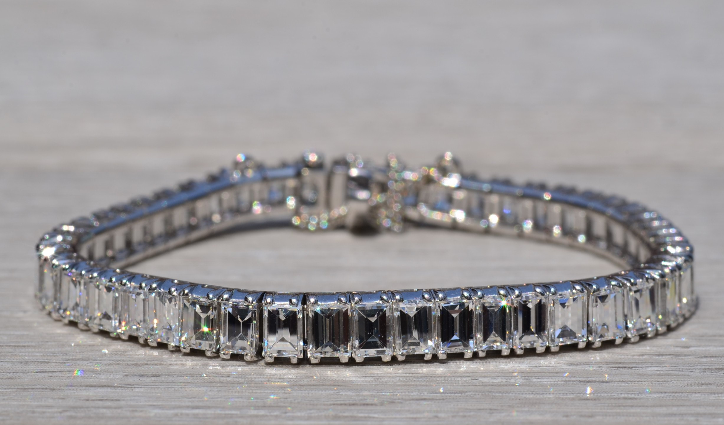 The Magnificent: Antique Platinum Tennis Bracelet with Emerald Cut Diamonds